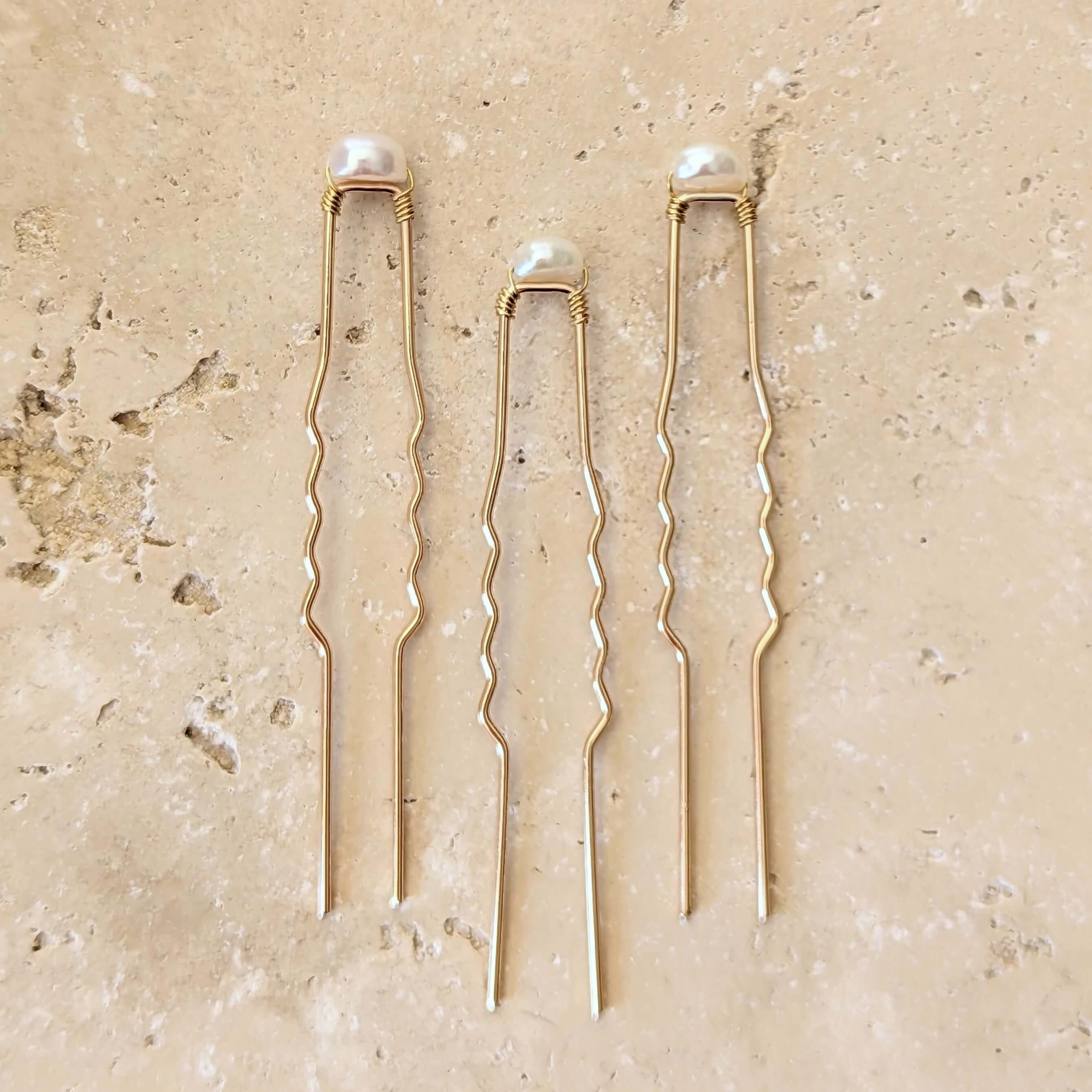 three baroque pearl hair pins in gold