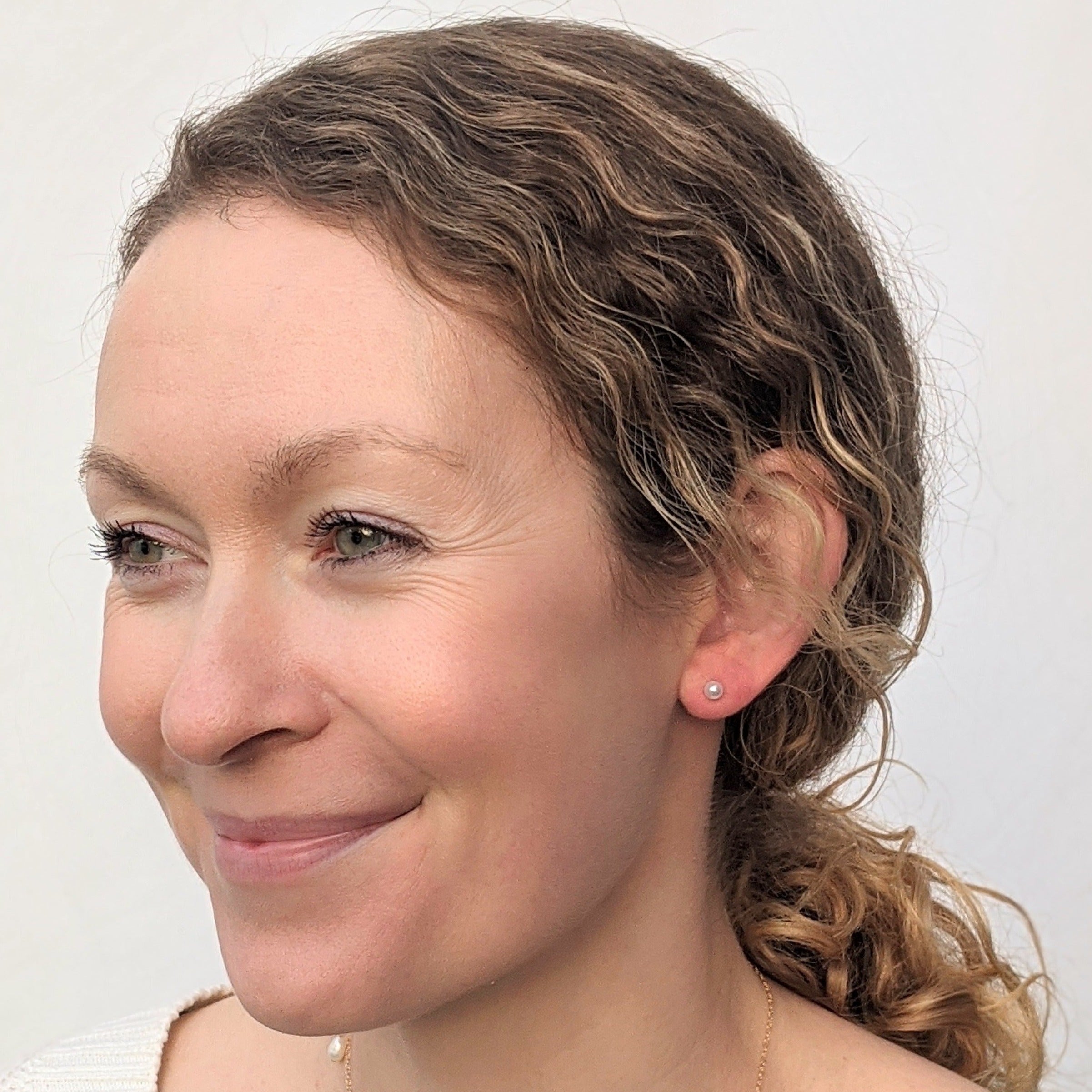 Tiny round pearl stud earrings model